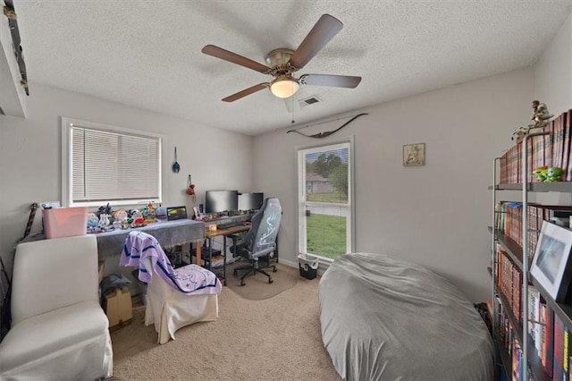 18828-30 E Wigwam Pl, Independence, MO 64056 - carpeted home office with a ceiling fan and a textured ceiling