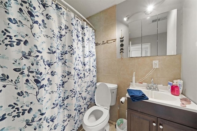 18828-30 E Wigwam Pl, Independence, MO 64056 - bathroom featuring tile walls, backsplash, toilet, a shower with curtain, and vanity