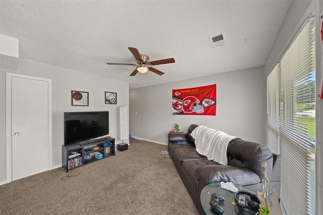 18828-30 E Wigwam Pl, Independence, MO 64056 - carpeted living room featuring ceiling fan, a textured ceiling, and baseboards