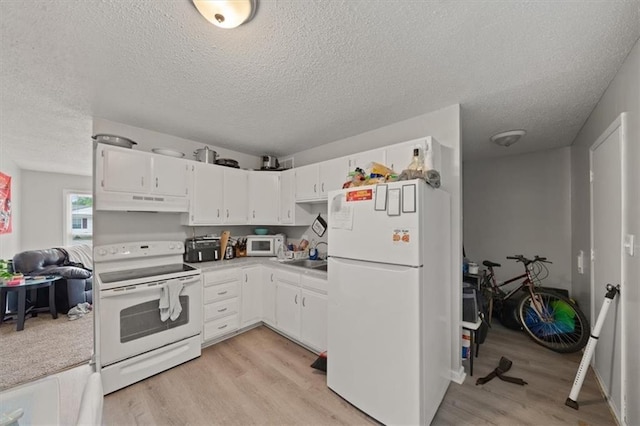 18828-30 E Wigwam Pl, Independence, MO 64056 - kitchen featuring white appliances, light wood-style flooring, white cabinetry, a textured ceiling, and under cabinet range hood