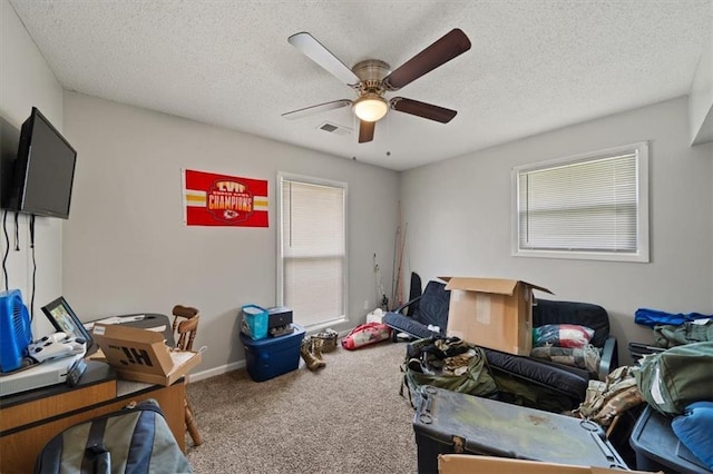 18828-30 E Wigwam Pl, Independence, MO 64056 - carpeted bedroom featuring a ceiling fan, a textured ceiling, and baseboards