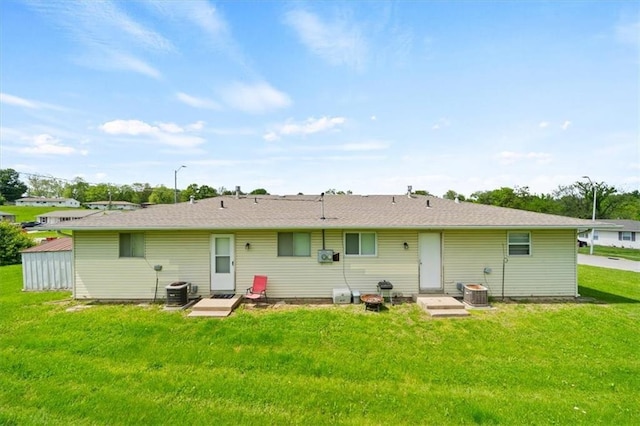 18828-30 E Wigwam Pl, Independence, MO 64056 - rear view of house featuring a yard and central air condition unit