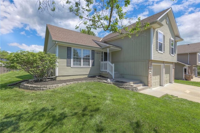 1102 Manse Dr, Raymore, MO 64083 - view of front of property with driveway, an attached garage, and a front lawn