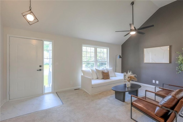 1102 Manse Dr, Raymore, MO 64083 - living area with vaulted ceiling, carpet flooring, a ceiling fan, and baseboards