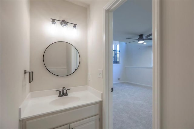 1102 Manse Dr, Raymore, MO 64083 - bathroom featuring ceiling fan and vanity