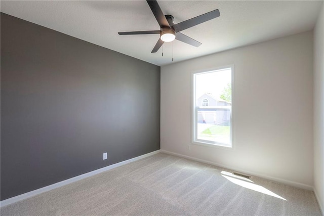 1102 Manse Dr, Raymore, MO 64083 - unfurnished room featuring ceiling fan, light colored carpet, and baseboards