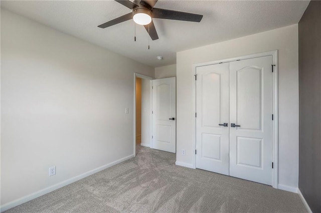 1102 Manse Dr, Raymore, MO 64083 - unfurnished bedroom with baseboards, carpet flooring, a closet, and ceiling fan