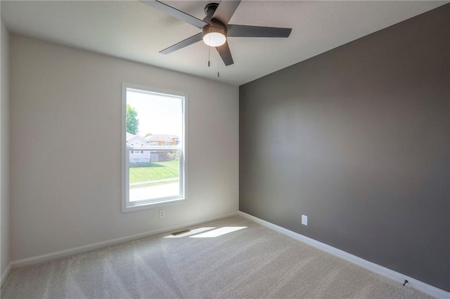 1102 Manse Dr, Raymore, MO 64083 - carpeted empty room featuring a ceiling fan and baseboards