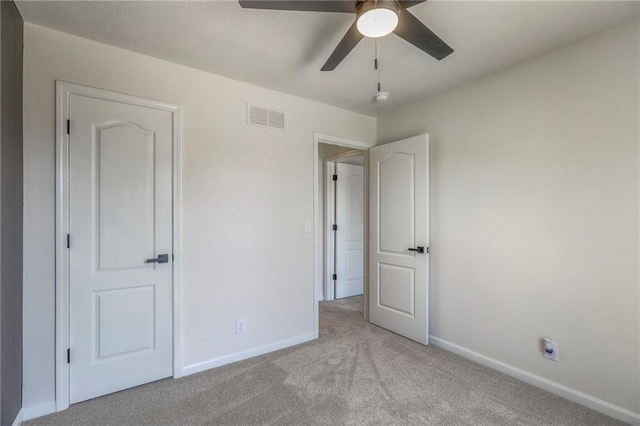 1102 Manse Dr, Raymore, MO 64083 - unfurnished bedroom featuring carpet flooring, baseboards, and ceiling fan