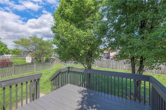 1102 Manse Dr, Raymore, MO 64083 - deck with a shed and an outbuilding