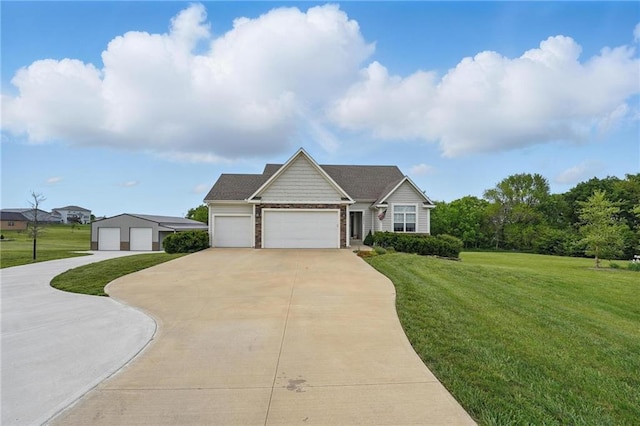 17311 Blue Moon Ln, Tonganoxie, KS 66086 - view of front of house featuring driveway, a front yard, and a garage