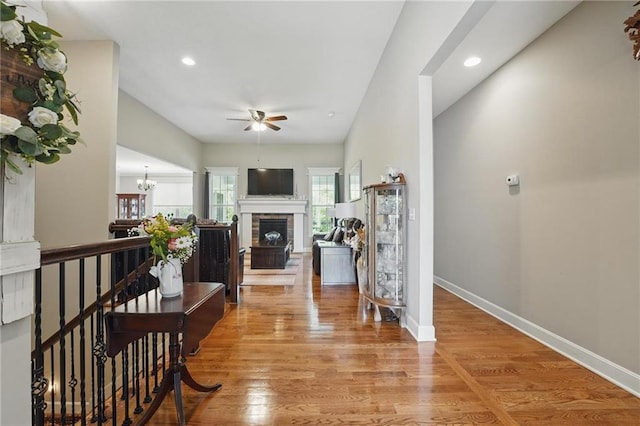 17311 Blue Moon Ln, Tonganoxie, KS 66086 - corridor with an upstairs landing, wood finished floors, baseboards, a chandelier, and recessed lighting