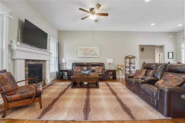 17311 Blue Moon Ln, Tonganoxie, KS 66086 - living area with a ceiling fan, wood finished floors, a stone fireplace, recessed lighting, and baseboards