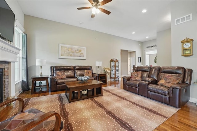 17311 Blue Moon Ln, Tonganoxie, KS 66086 - living room with a ceiling fan, a fireplace, wood finished floors, baseboards, and recessed lighting