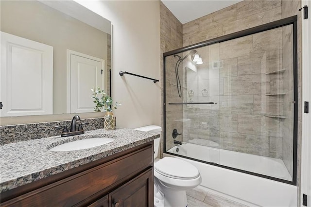 17311 Blue Moon Ln, Tonganoxie, KS 66086 - bathroom with vanity, toilet, and combined bath / shower with glass door