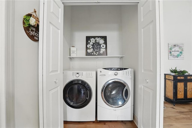 17311 Blue Moon Ln, Tonganoxie, KS 66086 - laundry area featuring independent washer and dryer and wood finished floors