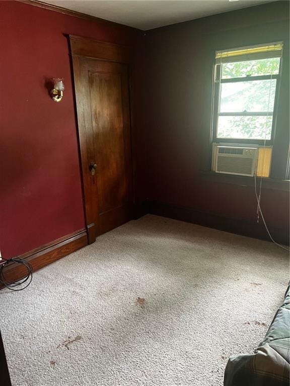 315 W 4th St, Ottawa, KS 66067 - carpeted empty room featuring cooling unit and baseboards
