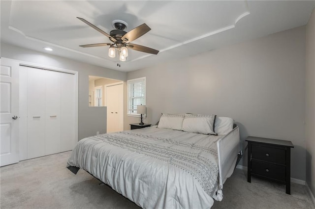 carpeted bedroom with a closet, recessed lighting, and ceiling fan