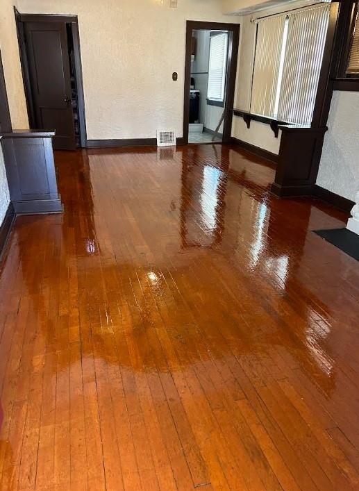 3637 Bales Ave, Kansas City, MO 64128 - spare room featuring hardwood / wood-style flooring and baseboards