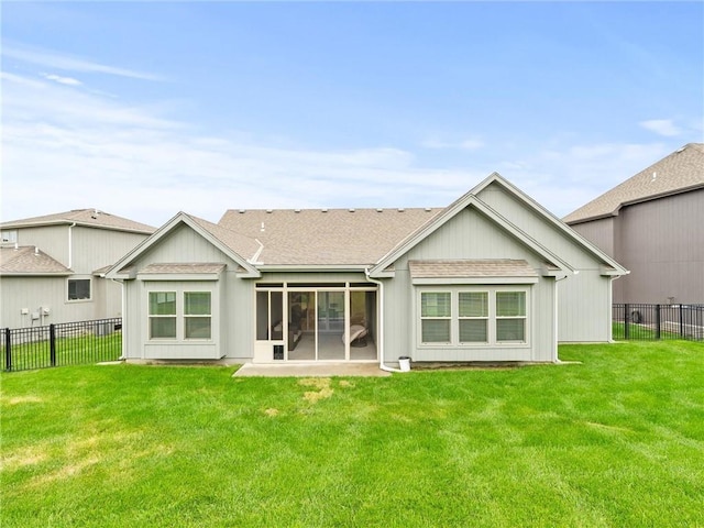 11382 S Longview Rd, Olathe, KS 66061 - back of property with a fenced backyard, roof with shingles, and a sunroom