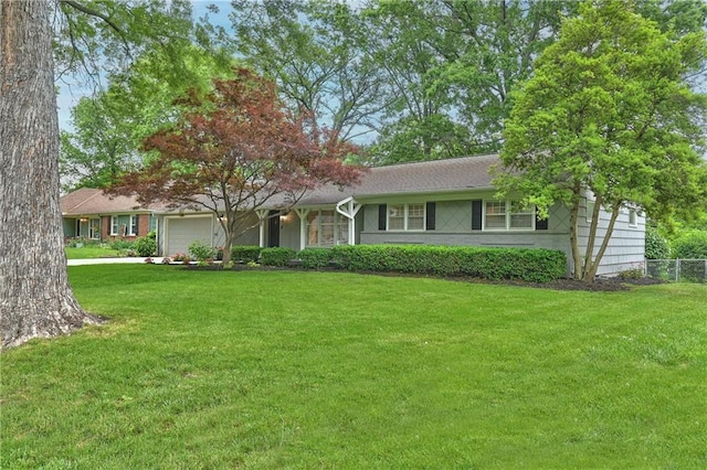 6411 Outlook Dr, Mission, KS 66202 - ranch-style house featuring an attached garage