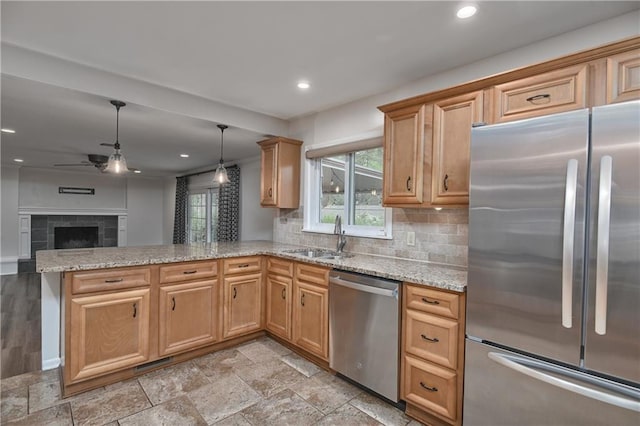6411 Outlook Dr, Mission, KS 66202 - kitchen with appliances with stainless steel finishes, a sink, a peninsula, a ceiling fan, and open floor plan