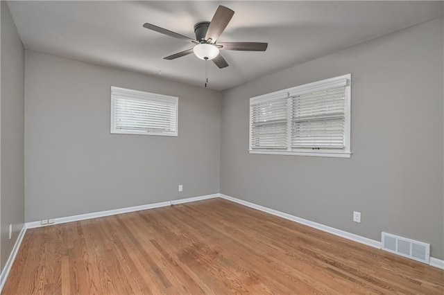 6411 Outlook Dr, Mission, KS 66202 - spare room featuring baseboards, ceiling fan, and light wood-style flooring