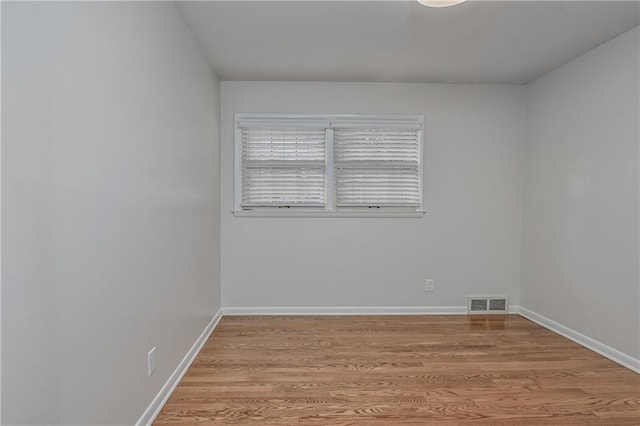 6411 Outlook Dr, Mission, KS 66202 - empty room with light wood-style flooring and baseboards