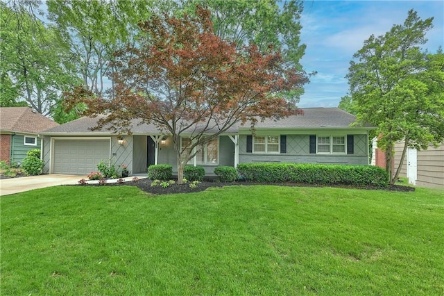 6411 Outlook Dr, Mission, KS 66202 - single story home featuring an attached garage, concrete driveway, and a front yard