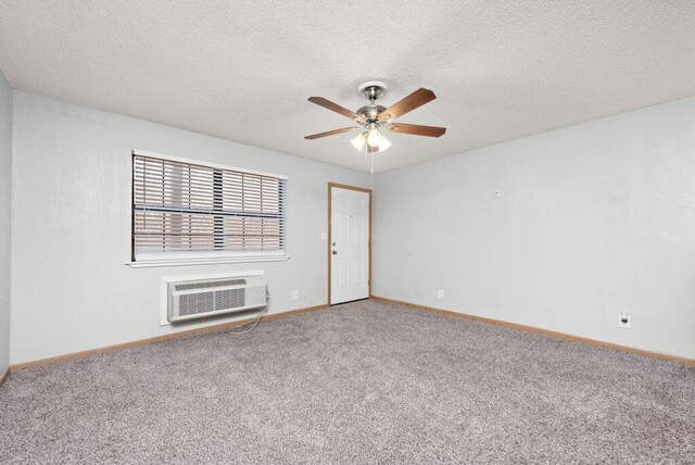312 2nd St, Platte City, MO 64079 - unfurnished room with a wall mounted air conditioner, carpet, ceiling fan, baseboards, and a textured ceiling