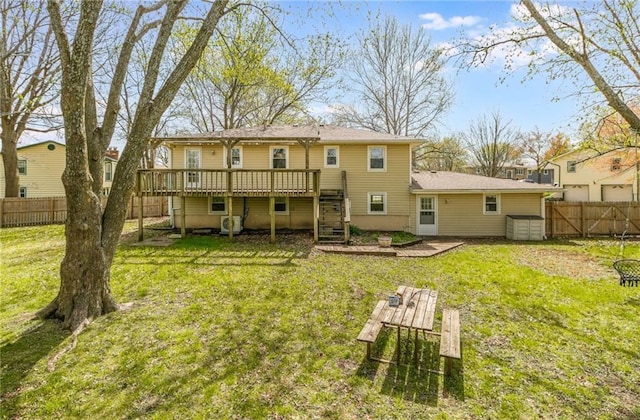 back of house featuring stairway and a deck
