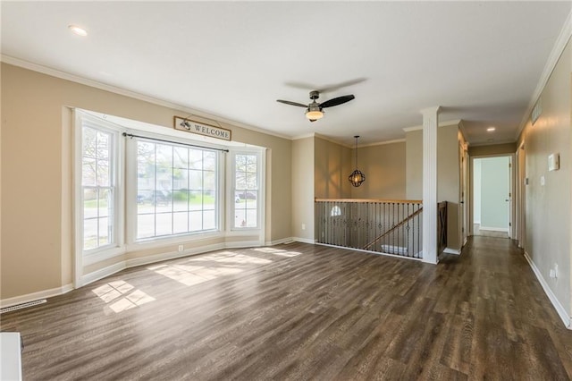 unfurnished living room with dark wood-type flooring, crown molding, baseboards, a ceiling fan, and recessed lighting