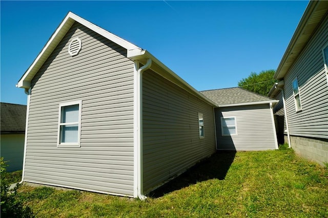 view of property exterior featuring a yard
