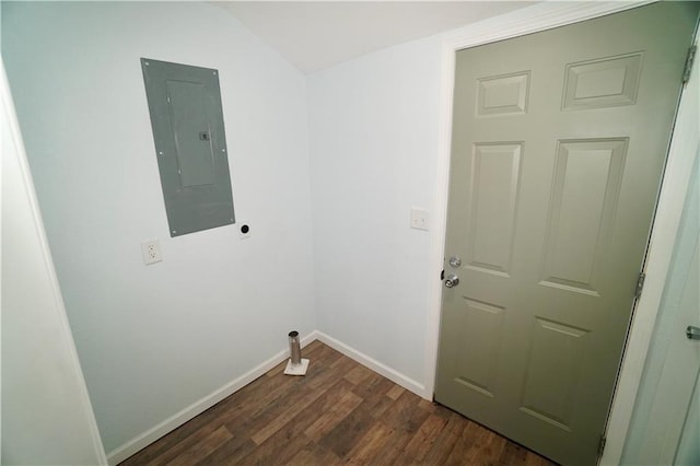 clothes washing area with electric panel, dark wood-style floors, baseboards, and electric dryer hookup