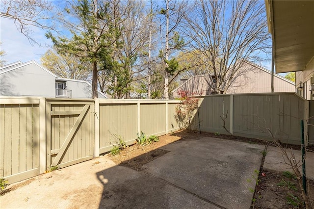 view of patio featuring a gate and fence