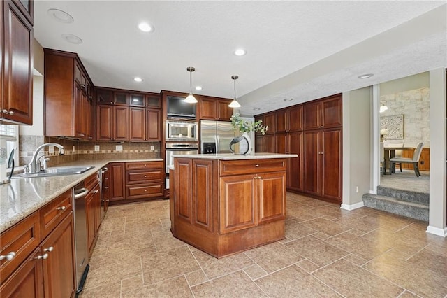14927 S Caenen Ln, Olathe, KS 66062 - kitchen with a sink, stainless steel appliances, recessed lighting, tasteful backsplash, and hanging light fixtures