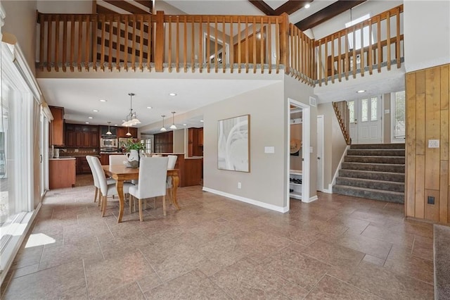 14927 S Caenen Ln, Olathe, KS 66062 - dining area featuring baseboards, a high ceiling, stairs, and recessed lighting