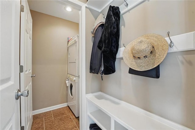 14927 S Caenen Ln, Olathe, KS 66062 - laundry room with stacked washer and clothes dryer, baseboards, tile patterned floors, and recessed lighting