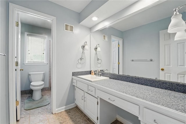 14927 S Caenen Ln, Olathe, KS 66062 - full bathroom with vanity, toilet, baseboards, and tile patterned flooring