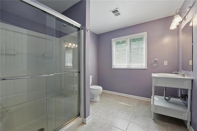 14927 S Caenen Ln, Olathe, KS 66062 - bathroom with toilet, vanity, a stall shower, baseboards, and tile patterned floors