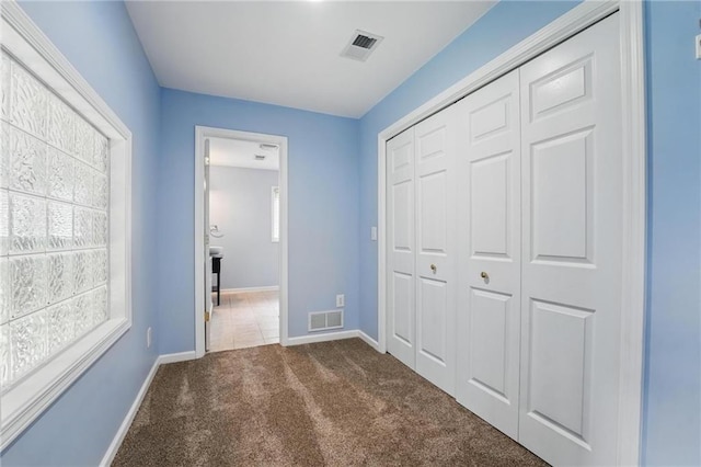 14927 S Caenen Ln, Olathe, KS 66062 - unfurnished bedroom featuring carpet, a closet, multiple windows, and baseboards