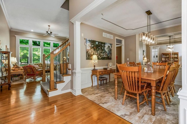 9008 N Hunter Ave, Kansas City, MO 64157 - dining space with a ceiling fan, ornamental molding, stairs, light wood-style flooring, and ornate columns