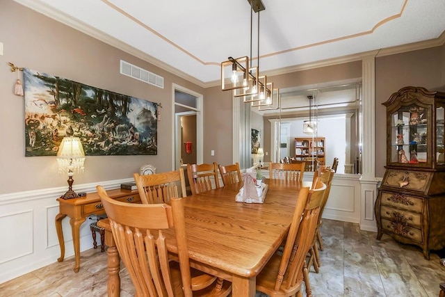 9008 N Hunter Ave, Kansas City, MO 64157 - dining area with a decorative wall, ornamental molding, and wainscoting