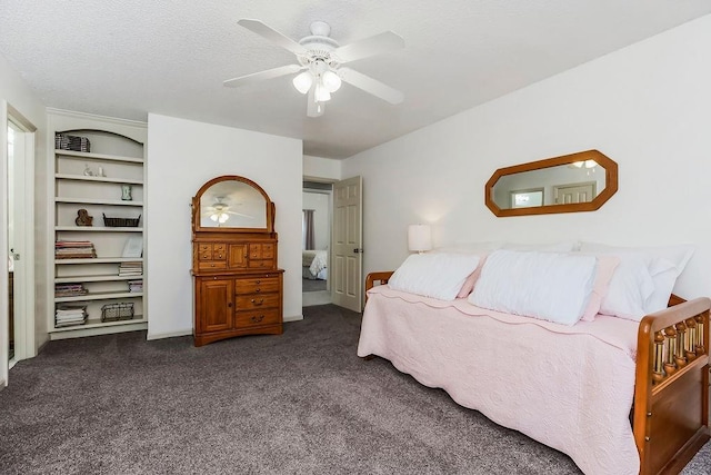 9008 N Hunter Ave, Kansas City, MO 64157 - bedroom with carpet flooring, a ceiling fan, and a textured ceiling