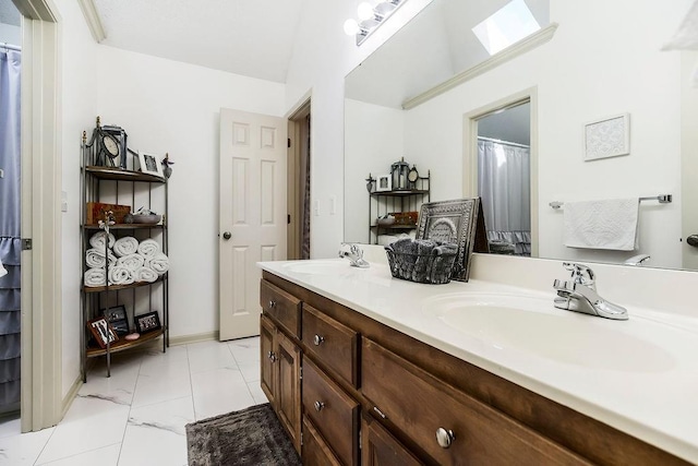 9008 N Hunter Ave, Kansas City, MO 64157 - bathroom featuring double vanity and marble finish flooring