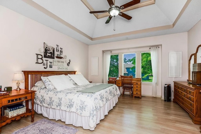 9008 N Hunter Ave, Kansas City, MO 64157 - bedroom featuring light wood finished floors, a raised ceiling, ceiling fan, and baseboards