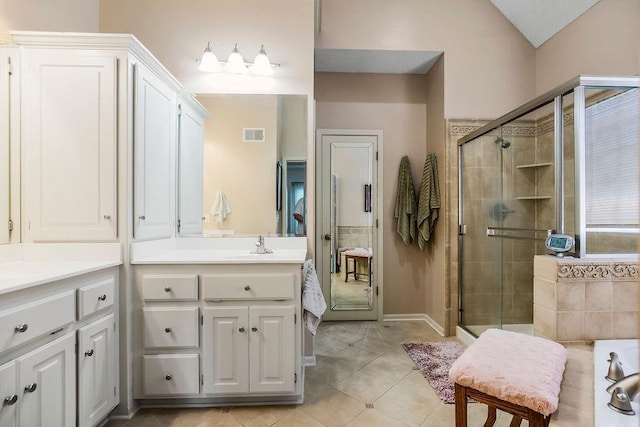 9008 N Hunter Ave, Kansas City, MO 64157 - full bathroom with a stall shower, vanity, and tile patterned flooring