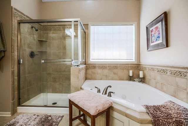 9008 N Hunter Ave, Kansas City, MO 64157 - bathroom with a shower stall, a tub with jets, and tile patterned flooring