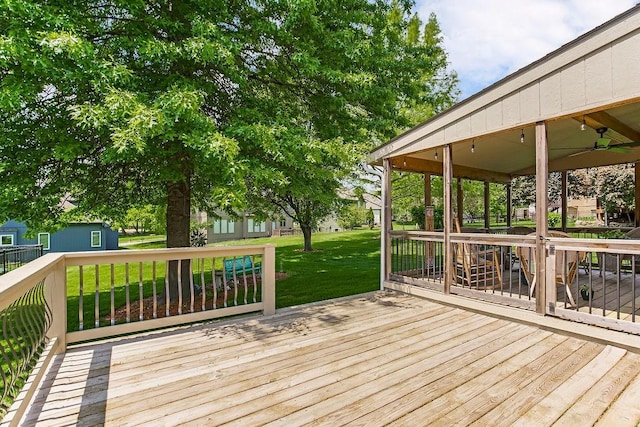 9008 N Hunter Ave, Kansas City, MO 64157 - deck with a yard and a ceiling fan