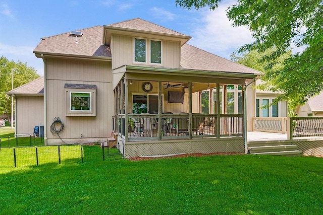 9008 N Hunter Ave, Kansas City, MO 64157 - rear view of house with roof with shingles, a deck, a sunroom, and a ceiling fan